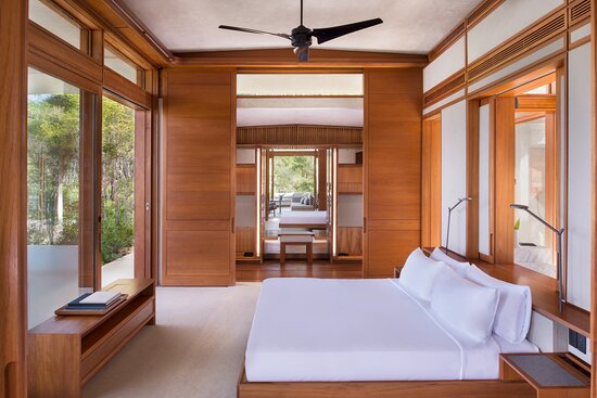 Amanera — guest suite with hardwood paneling and forest views
