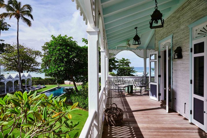 Playa Grande Beach Club — wraparound veranda with lanterns and ocean view