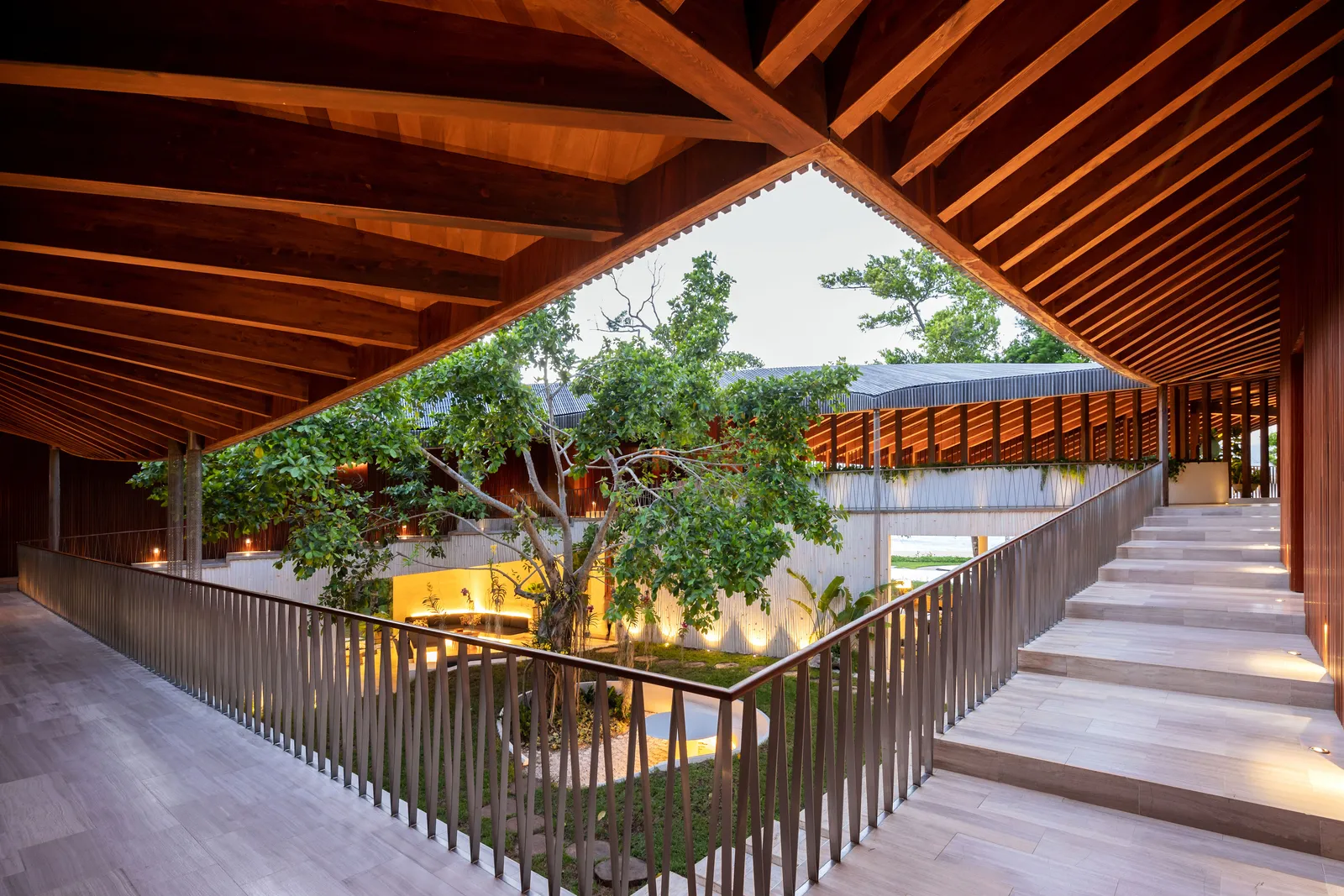 Playa Grande II — wood-beam ceiling and central courtyard, looking toward the ocean