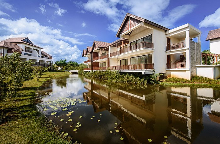 Portillo Beach Club — residential apartments mirrored in the lily pond