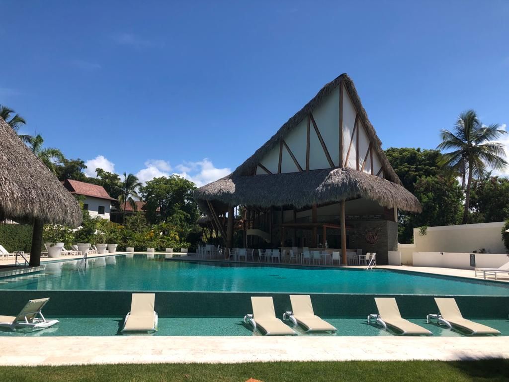 Portillo Beach Club — main pool and the thatched-roof central pavilion